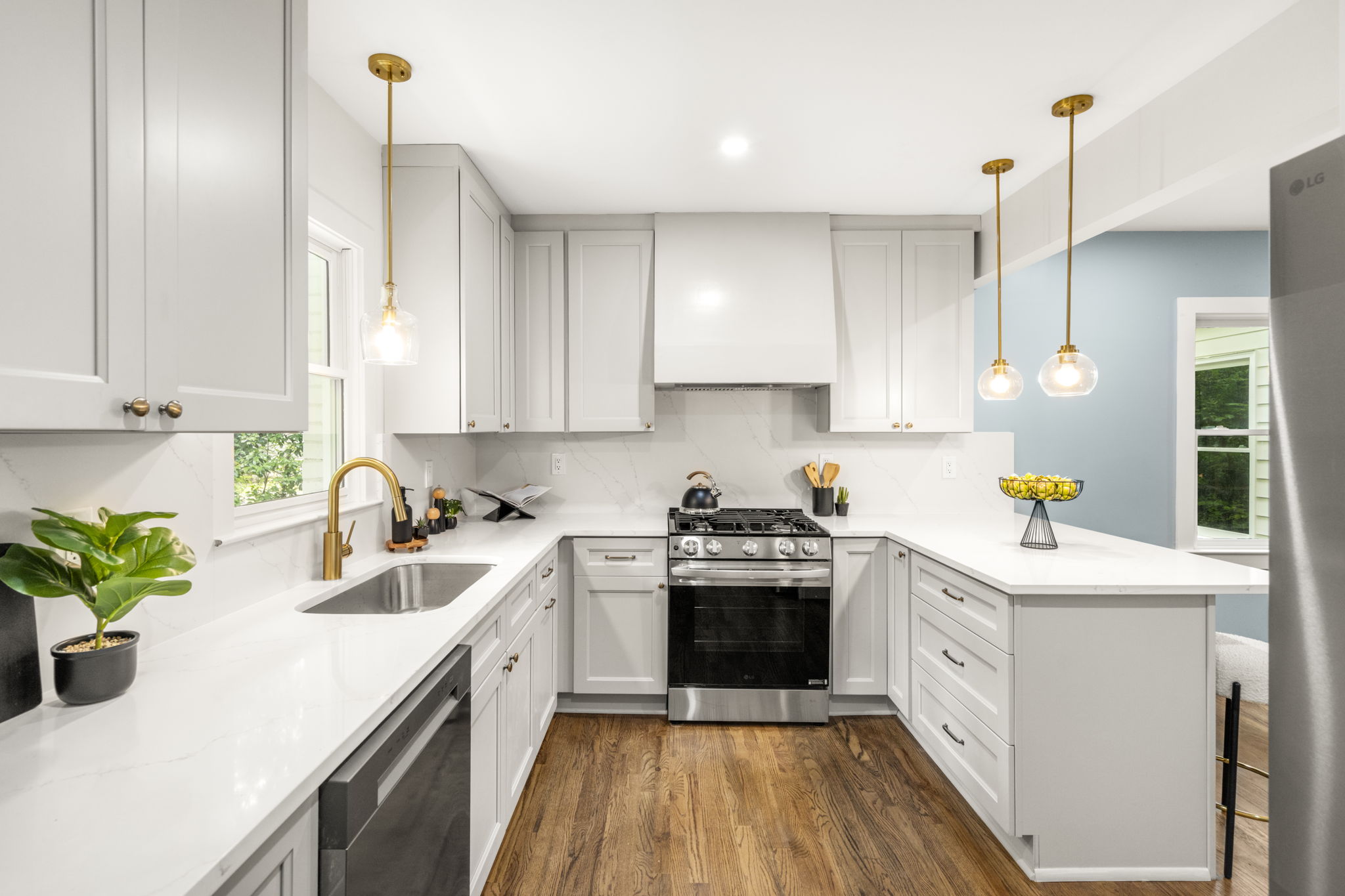 renovated kitchen with quartz countertops and stainless steel appliances at 65 Roseclair Drive